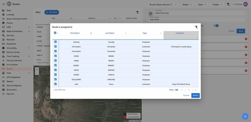 A modal window titled "Route is assigned to" displays a table with columns for First Name, Last Name, Type, and Company. Each row has a checkbox, and multiple rows are checked, indicating selected individuals. The table shows names like Anthony Cassidy (Employee), Christopher Fernandez (Contractor), and John Snow (Contractor). Below the table, it indicates "1-30 of 30 rows" and has a "Rows 100" dropdown, along with "Cancel" and "Select" buttons. The background shows a map and a "Routes" interfac